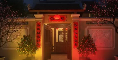 Đèn pha LED đổi màu trang trí Tết trước nhà với ánh sáng đỏ và vàng theo phong thủy.